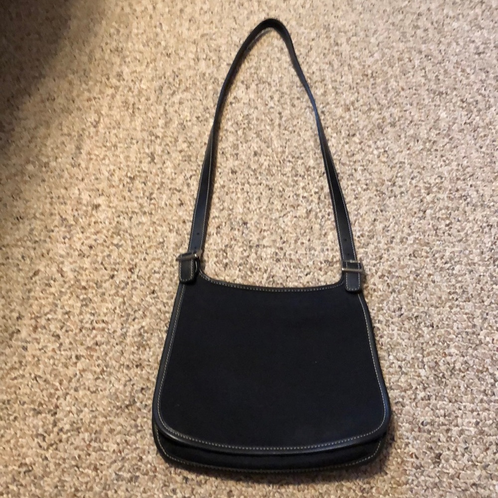 Unique coach slash bag.